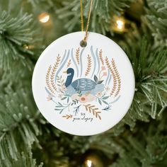 a ceramic ornament hanging on a christmas tree