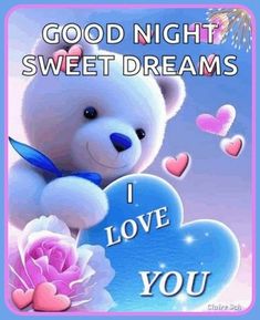 a white teddy bear sitting on top of a blue heart with words good night sweet dreams i love you