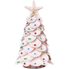 a white christmas tree made out of paper plates and decorated with confetti on top