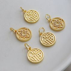 Material: Brass Description High quality 14K gold plated brass, color not easily tarnish Size: 13mm, thick 2.1 mm Quantity: 5 pcs. Color: 14K gold Material: 14K gold plated brass ❤ More pendants items here: ❤ https://www.etsy.com/hk-en/shop/basicDIYcraftstore?ref=simple-shop-header-name&listing_id=806990990&section_id=29121362 ❤ More other items here: ❤ https://www.etsy.com/shop/basicDIYcraftstore?ref=simple-shop-header-name&listing_id=823835581 Shipping Following is the place that o Gold Plated Pendant Charms, Gold-plated Tarnish Resistant Charms, Yellow Gold Plated Round Charm Necklaces, Plated Yellow Gold Round Charm Necklaces, Gold Engraved Charms For Good Luck, Gold Engraved Good Luck Charms, Good Luck Gold Charms With Engraving, Gold Round Pendant Charms For Good Luck, Gold Medallion Charm Necklace For Good Luck