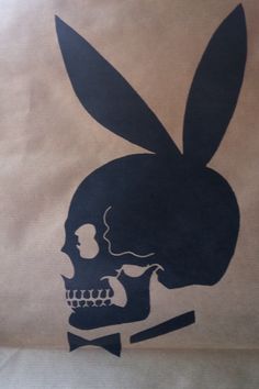 a paper bag with a skull and bunny ears on it