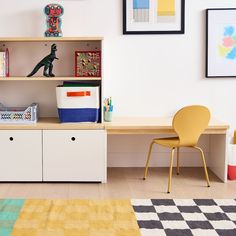 a child's playroom with toys, bookshelf and toy storage units