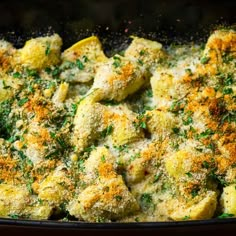 a casserole dish with cheese and herbs