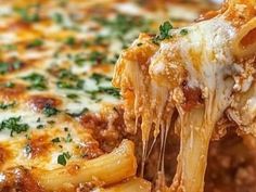 a slice of pasta being lifted from a casserole dish