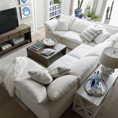 a living room filled with furniture and a flat screen tv