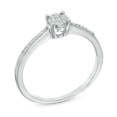 a white gold engagement ring with diamonds on the shoulders and side stones around the band