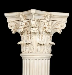 a white marble column with intricate designs