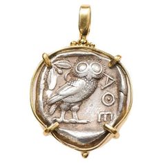 A Silver Tetradrachm [coin] from the late 5th century BC. This spectacular coin of Athena and an owl are trimmed with 22 karat gold. On the obverse side is the head of Athena, wearing a circular earing and a crested helmet with three olive leaves. On the reverse side, an owl face right with letters "AOE" written down the right side. This coin has been inspected and approved to be authentic by a professional Numismatic who specializes in ancient coinage. A Certificate of Authenticity will accompa Owl Face, Olive Leaves, Greek Coins, Silver Horse, Antique Pendant, Owl Pendant, Antique Necklace, Jewelry Unique, Coin Pendant