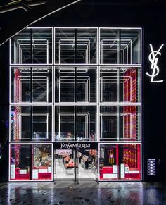 a store front that is lit up with neon lights on the outside and inside it