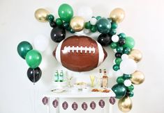 a football themed party with balloons and streamers