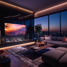 a living room with large windows and a big screen tv on the wall in front of it