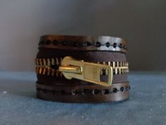 This leather cuff has a sturdy zipper hand stitched to a split leather band. Adjustable snap closure. Unisex. Upcycle Zippers, Dream Style, Sewing Project, Leather Cuffs, Leather Band, Jewelry Ideas, Hand Stitching, Leather Bracelet, Cuff Bracelets