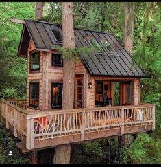 a tree house in the middle of a forest