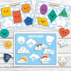 the weather cards are arranged on a wooden table with clouds, sun and rainbows