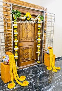 an entrance decorated with yellow flowers and garlands