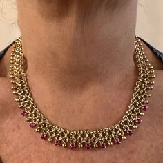 Vintage Tiffany & Co 18k Yellow Gold Ruby Collar Necklace    Metal: 18k Yellow Gold  Length: 16"  Weight: 77.1 grams  Width: 15mm  Stones: 11 round rubies total weight approximately 5ct  Hallmarks: Tiffany & Co 18k Made In Italy T2541rrdd      Please read description for most accurate dimensions and use QA to inquire on any additional details. Gold Ruby Necklace Fine Jewelry, Fine Ruby Necklace For Celebration, Elegant Ruby Temple Necklace For Formal Occasions, Elegant Ruby Temple Necklace For Formal Events, Hand Set Round Ruby Necklaces, Hand Set Round Ruby Necklace, Formal Gold Necklace With Ruby, Gold Ruby Temple Necklace For Formal Occasions, Formal Gold Ruby Necklace