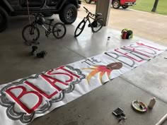 the banner is being put on the garage floor