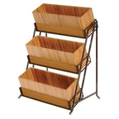 three tiered bamboo trays with metal handles on each side and two wooden baskets in the middle