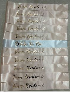 four ribbons with the names of each bride and groom