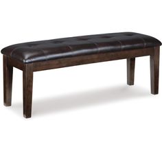 a wooden bench with brown leather upholstered seat