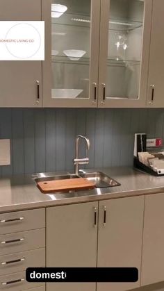 a kitchen with stainless steel counter tops and cabinets