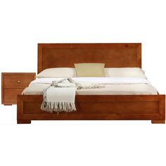 a bed with two nightstands and a blanket on top of the headboard in front of it