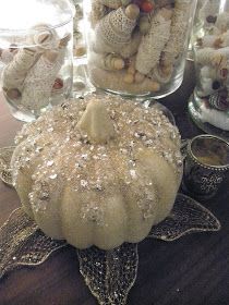 a table topped with lots of glass jars filled with different types of food and decorations