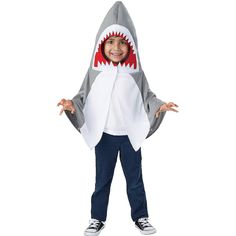 a little boy wearing a shark costume