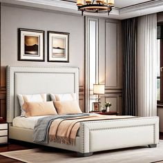 a large white bed sitting in a bedroom next to a window