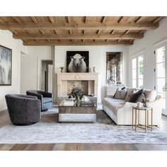 a living room filled with furniture and a fire place