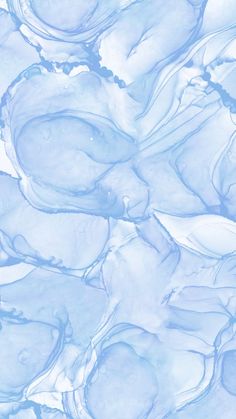 an abstract blue and white background with lots of watercolor paint on the bottom half of it