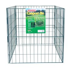 a large metal dog pen with the cover pulled up to it's sides, and an ad for compost bin