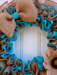 a burlock wreath with sunflowers and burlocks on the front door