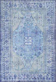 a blue and white rug with an intricate design on the middle, in front of a white background