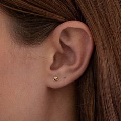 Inspired by the stars, each petite stud playfully sits on the ear with its feminine charm. Small yet curious, the Mini Star stud earrings reminisce of a starry night. - Gold Vermeil - Coated in 18K gold (2.5 microns) - Sterling Silver Base - Height: 4mm - Width: 4mm JEWELRY CARE As with all metals, special care must be taken to ensure they do not scratch or tarnish over time. Follow these simple steps to keep your pieces looking their best:Avoid direct contact when applying cosmetics, perfumes, Stud Gold Earrings, Star Stud Earrings, Small Gold Earrings, Gold Earrings Studs Simple, 2 Ear Piercings, Starter Earrings, Ear Piercing Studs, Gold Star Earrings, Mini Earrings