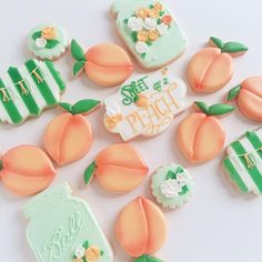 decorated cookies are arranged in the shape of peaches and mason jars with flowers on them