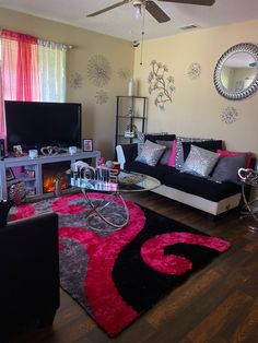 a living room filled with furniture and a flat screen tv