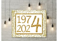 a white and gold wall hanging on a brick wall