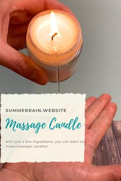 a person holding a candle in their hand with a business card attached to it that reads, summer rain website massage candle