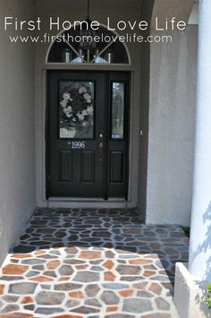 the front door of a home with stone steps leading up to it