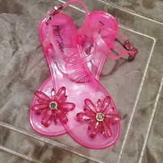 Betsey Johnson Women's Tabby Jelly Pink Flower Sandals Betsey Johnson Sandals, Spring Party Jelly Sandals, Pink Jelly Sandals With Ankle Strap For Party, Pink Ankle Strap Jelly Sandals For Party, Pink Ankle Strap Jelly Sandals For Summer, Pink Jelly Sandals For Spring Party, Pink Flower Sandals For Vacation, Pink Ankle Strap Jelly Sandals For Vacation, Pink Flower Sandals For Summer