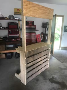 a work bench made out of pallets in a garage