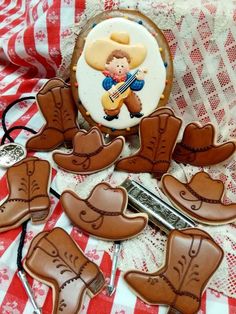 cowboy themed cookies are arranged on a table