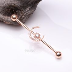 Add some sparkle and shine to your industrial piercing with our Rose Gold Sparkle Moon and Starburst Industrial Barbell. The elegant combination of rose gold and starburst design will surely make a statement. * Material: 316L Stainless Steel Rose Gold Plated * Size: 14 GA (1.6mm), 38mm (1-1/2") * Moon & Starburst charm measures about 12mm wide and can be placed anywhere on the bar Suitable for * Ear Piercings (Industrial/Scaffold, Transverse Lobe) It is always recommended to know your exact pier Cute Industrial Piercing, Transverse Lobe, Industrial Bar Piercing, Ear Piercings Industrial, Industrial Piercing Jewelry, Golden Sparkle, Rose Gold Sparkle, Industrial Barbell, Industrial Piercing