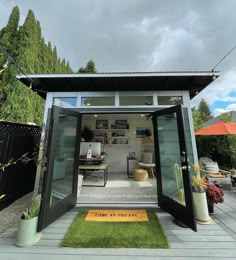 an outdoor living area with grass and plants