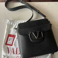 Valentino Loc Crossbody Calfskin Bag Drop Length: 55 Cm / 19.6 In. W23xh25xd6 Cm / W9x9.8xd2.3 In. Brand New In Box Includes Dust Bag, Tag Elegant Rectangular Shoulder Bag With Logo, Luxury Shoulder Bag With Logo, Luxury Crossbody Shoulder Bag With Logo, High-end Leather Shoulder Bag With Logo, Elegant Crossbody Bag With Logo, Elegant Leather Bags With Logo, Elegant Shoulder Bag With Logo, Designer Formal Shoulder Bag With Logo, Elegant Logo Shoulder Bag