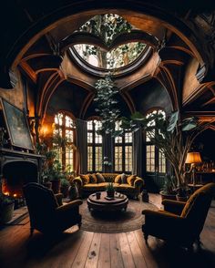 a living room filled with lots of furniture and windows