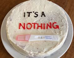 it's a nothing frosted cake on a plate with a toothbrush next to it