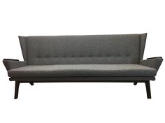 a gray couch sitting on top of a wooden frame