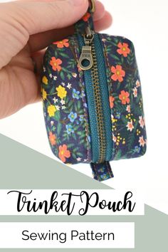 a hand holding a zippered pouch that has flowers on it and the words, tunnel pouch sewing pattern